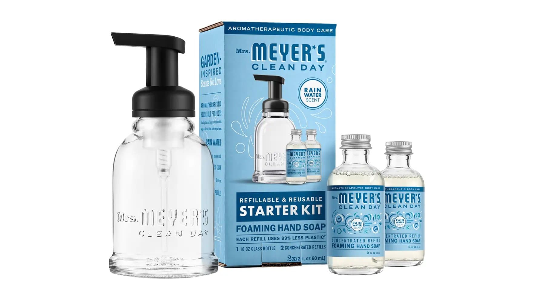 A hand soap starter kit includes a clear pump bottle and two refill bottles. The packaging reads, "Mrs. Meyer's Clean Day, Refillable & Reusable Starter Kit, Foaming Hand Soap, Rain Water Scent."